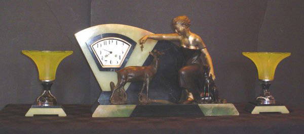 ART DECO 3PC CLOCK SET WITH LADY 14075: Extravagant art deco clock set with lady and dog. Dimensions: Clock: 14"H x 20 1/2"W x 10"D Sides: 9" H x 7" W x 7" D Age: C. 1920 Material: Marble