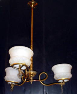 3 ARM GAS LIGHT WITH SHADES 438: Custom three arm gas light with white glass shades. Dimension: 28 1/2" H x 23 1/2" W Age: C. 1890 Material: Brass