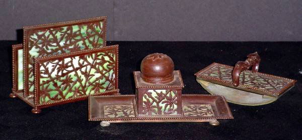 APOLLO STUDIOS N.Y. DESK SET 10037: Excellent three piece Apollo desk set with green glass. Includes Blotter signed: Apollo Studios, New York, Inkwell, and Letter Rack. Dimensions: Blotter: 5 1/4" L x 2 3/4" W x 2 1/2" H Inkwell: 7 1/2"