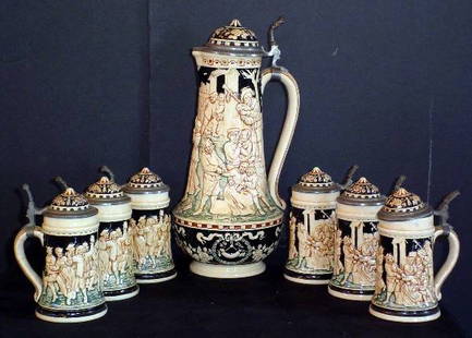 SET OF SEVEN BEER STEINS 1-PITCHER 6-MUGS 13951: Set of seven beer steins, 1-pitcher, 6-mugs, and 1 cover of mug damaged. (see photo) Signed: Depose w/diamond mark. Dimensions: Pitcher: 14.5" H x 6.5" W Mugs: 6.5" H x 4" W Age: C. 1900 