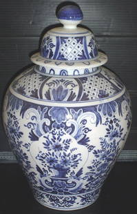 BLUE AND WHITE LARGE COVERED JAR 3008: Blue and white large covered jar with flowers. Dimensions: 16"H x 10"Diameter Age: Material: Pottery