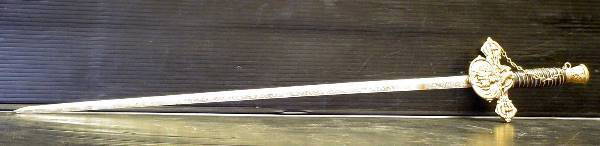 SWORD WITH ENGRAVED BLADE 967: Great sword with engraved blade. Dimensions: 32 3/4" L x 5 1/4" W Age: C. 1920 Material: Iron