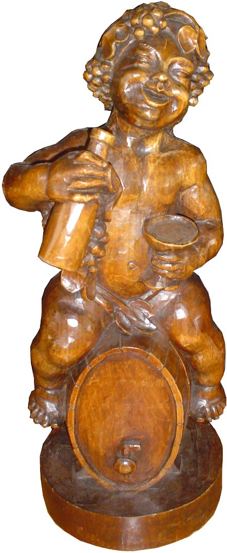 CVD WOOD BOY SITTING ON A WINE BARREL STATUE 15778: Statue of a boy sitting on a wine barrel drinking. Dimensions: 16"H x 6"Diameter Age:C.1880 Material: Wood