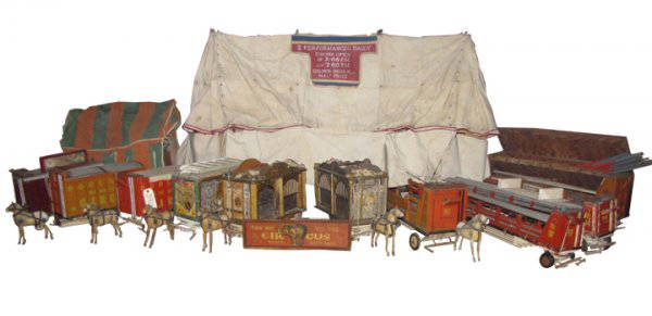 COMPLETE TRAVELING DOOLANS MINIATURE CIRCUS 3908: An incredible find, you can find single wagons but never a whole set! This complete folk art hand painted wood traveling circus includes 10 horse drawn wagons,two tents, tent poles, banners , advertis