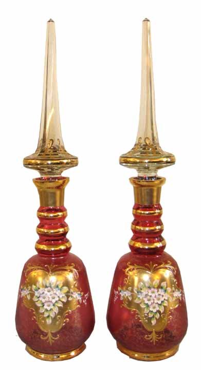 PR LG ENAMELED ART GLASS DECANTERS 3301: Fabulous pair of oversized ruby enameled decanters with hand painted floral scene and large stoppers. Dimensions: 28"H x 7"Diameter Age: C.1890 Material: Glass