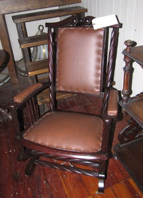 LABELED HUNZINGER PLATFORM ROCKER 1653: Labeled Hunzinger mahogany platform rocker. Dimensions: 37"H x 24"W Age: C. 1880 Material: Mahogany