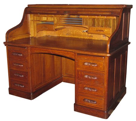 ANTIQUE CARVED QUARTERED OAK S ROLL TOP DESK 3326: Exceptional carved quartered oak "S" roll top executive desk with fitted interior. Dimensions: 50"H x 61"W x 35"D Age: C. 1890 Material: Oak