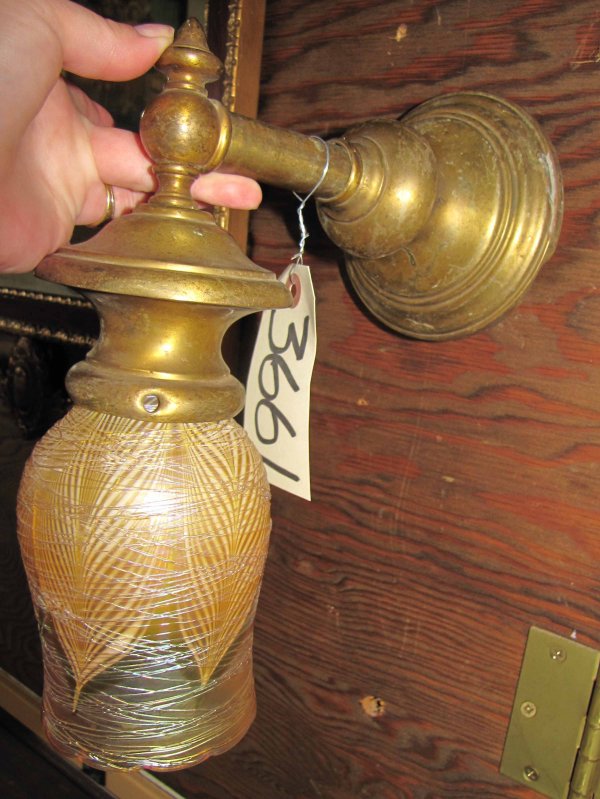 SINGLE BRASS WALL SCONCE W/ ART GLASS SHADE 3661: Single brass wall sconce with damaged art glass shade. Dimensions: 10.5"H x 5.5"W x 9.5"D Age: 1920 Material: brass and art glass