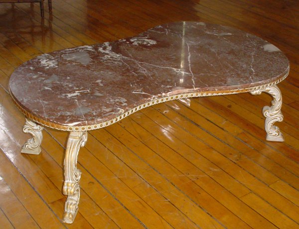 IRREGULAR SHAPED MARBLE TOP COFFEE TABLE 3185: Irregular shaped pink marble top painted white and gold accented coffee table. Dimensions: 17"H x 50"W x 30"D Age: Contemporary Material: Marble and Wood