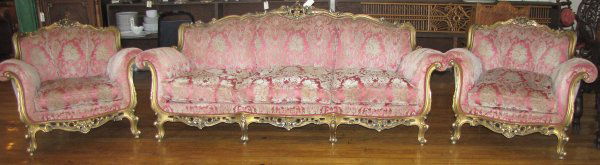 FRENCH ROCOCO THREE PC GILT PARLOUR SET 1502: French Rococo gilt parlour set with couch and two arm chairs. Dimension of couch: 36"H x 83"W. Age: 1900 Material:Gilt Wood