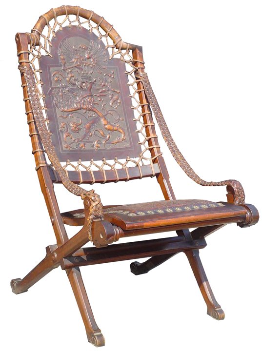 HAND TOOLED LEATHER CHAIR W/ ARMOR & BIRD 13541: Hand tooled leather chair with bird,knight helmet, and shield. Dimensions: 41"H x 23"W x 30"D Age: C.1860 Material: Leather and Wood