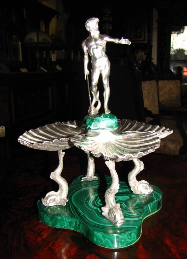 ELABORATE SILVER & MALACHITE NEPTUNE CNT PC 3722: Elaborate 800 silver and malachite serving dish with Neptune holding trident that detaches to be used as an h'our d'oevres fork and four seashells held by dolphins. Dimensions: 13"H x 7"W x 9"D. Age: 