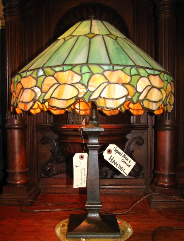 HANDEL LEADED GLASS LAMP SGND BASE & SHADE 9067: Marvelous singed Handel base & shade leaded stained glass table lamp. Dimensions; 23"H x 16.5"D Age: 1920 Material: glass & brass