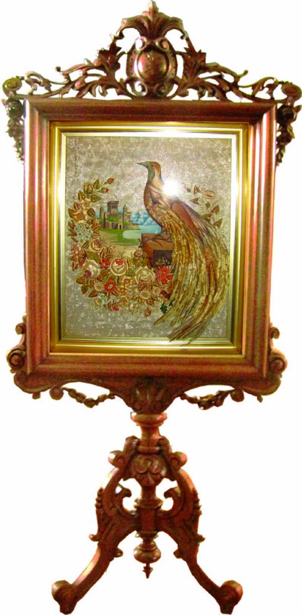 VICTORIAN PEACOCK FIRESCREEN W/ REAL FEATHERS 3467: Out of this world one of a kind carved walnut American Victorian firescreen remarkably carved with shield, floral garland and elaborate tripod base. To add to its uniqueness, it holds a two dimensiona