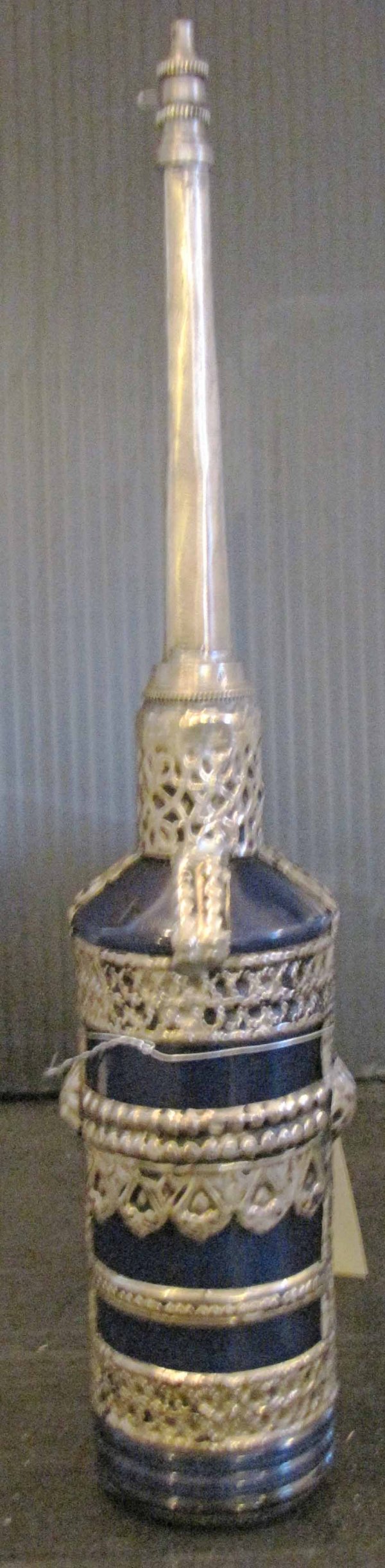 BLUE PERSIAN PERFUME BOTTLE W/ SILVER OVERLAY 1602: Blue persian perfume bottle w/ silver overlay Dimensions: 10.5"H x 2"W Age: 1900 Material: Glass & silver