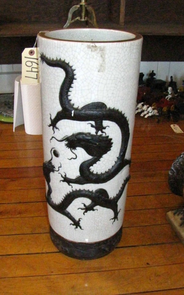 ORIENTAL DRAGON UMBRELLA STAND 1647: Oriental dragon umbrella stand. Dimensions: 23.5"H x 9" circ Materials: pottery Age: 1940