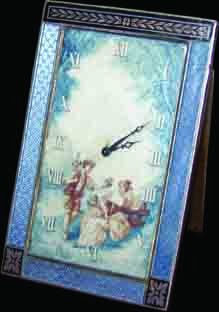 MINI CLOCK W/ PAINTING ON IVORY DIAL 750: Miniature French silver, bronze, and enamel bordered hand painted on ivory easel back table clock with courting couple scene. Marked 0.935 Argent Metal Dore. Dimensions: 4"H x 2.5"L x 2.75"W Age: 1920