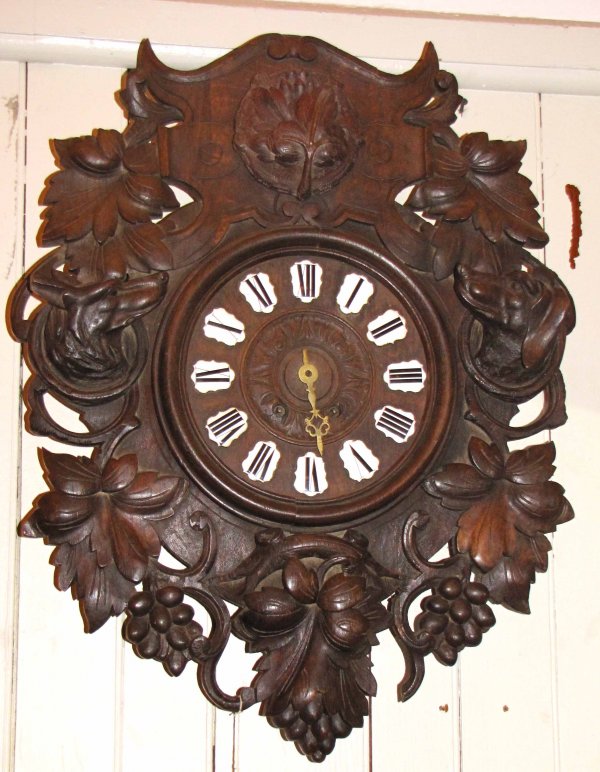 ANTIQUE BLACK FOREST WALL CLOCK WITH DOGS 1705: Black Forest wall clock with dogs Dimensions: 25"H x 15"W x 6"D Age: 1880 Material: Wood