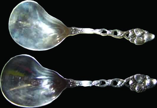 PR TIFFANY & CO STRAWBERRY PAT STERLING SPOONS 1666: Pair of signed Tiffany & Co. sterling silver serving spoons in the strawberry pattern. Both marked sterling but only 1 marked Tiffany. Total weight: 9 oz. Dimensions: 9.5"H x 3.5"W Material: Sterling 