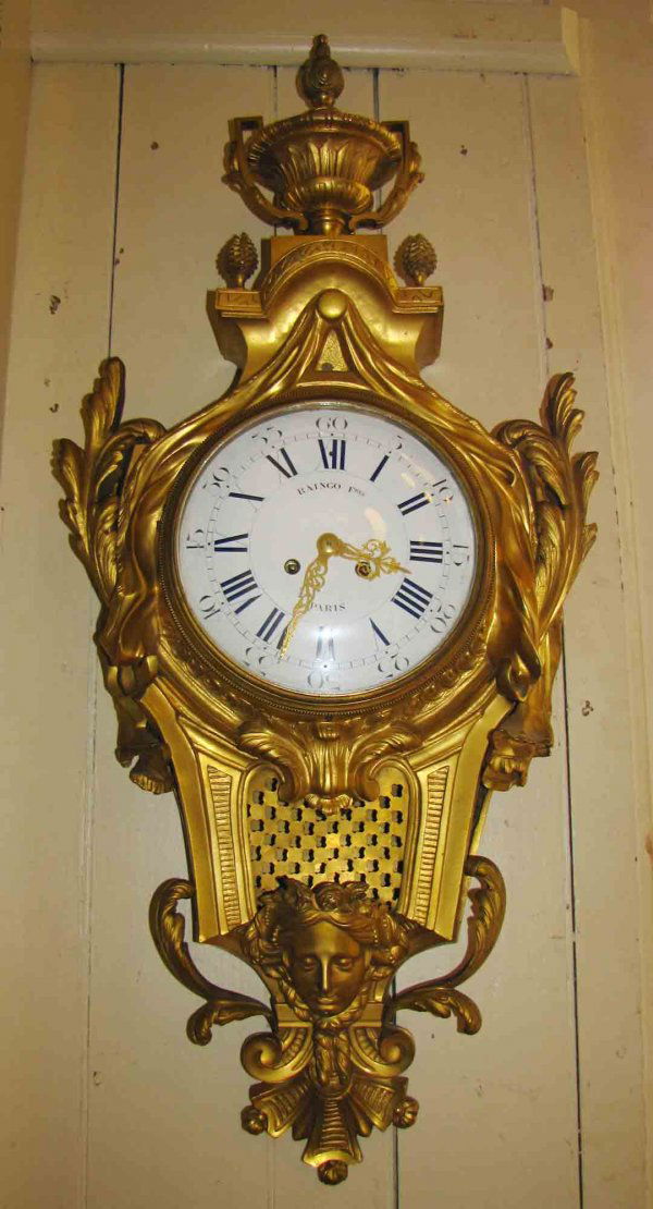 LG GILT BZ FRENCH WALL CLOCK W/ LADY HEAD 3968: Large gilt bronze French wall clock with lady head. Dimensions: 37"h x 16"w x 5"d Age: 1880 Material: Bronze & glass