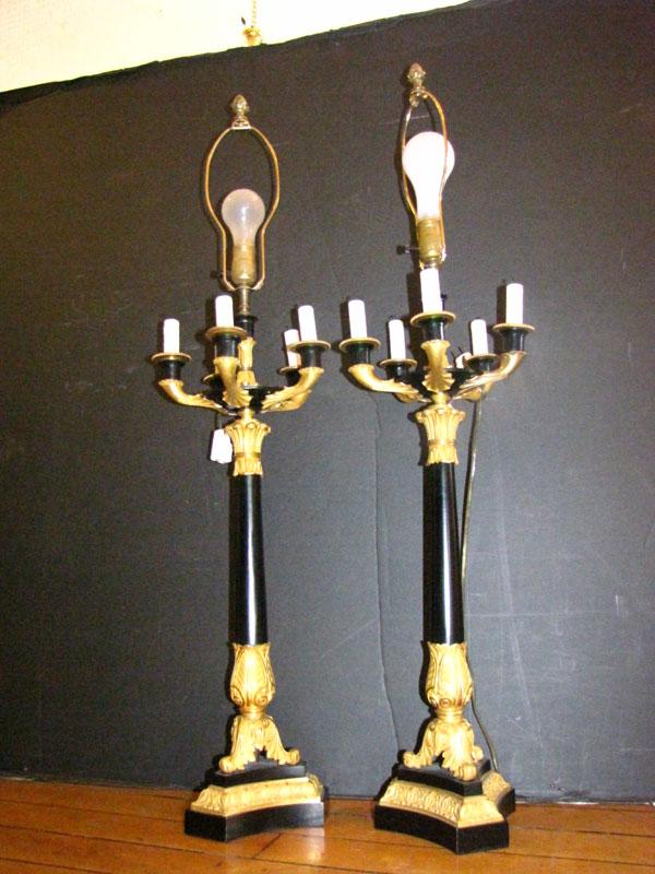 PR GILT BRONZE& EBONIZED LAMPS W/CANDLEABRA(1507): Pair of tall gilt bronze & ebonized Empire style lamps w/ candleabra. Dimensions: 39"h x 9.5"w Age: 1950 Material: Gilt bronze & ebonized metal