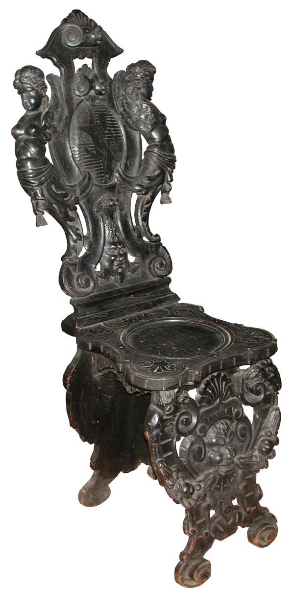 ELABORATE CVD WOOD SIDE CHAIR W/WINGED LADIES(4152): Elaborate carved wood side chair with winged ladies, North-wind face, ram heads, Pan w/ fruit garland & family crest w/ Griffin. Dimensions: 45"H x 16"W x 22"D Age: 1880 Material: Wood