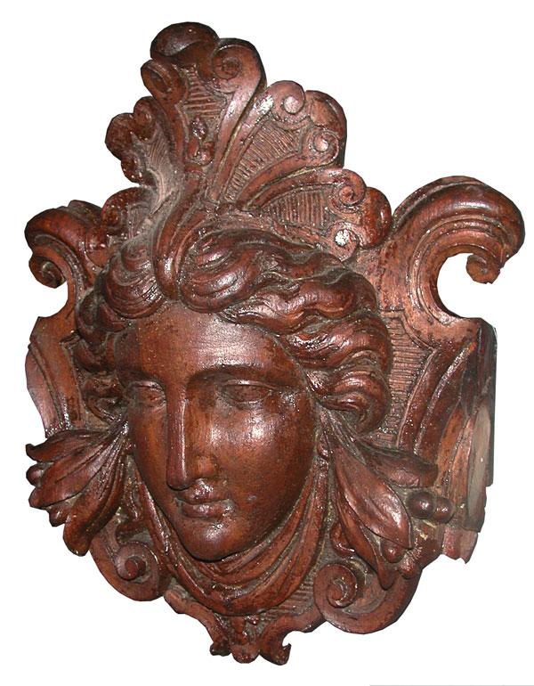 CVD WALNUT CROWNED JENNY LIND HEAD W/ SHIELD 4155: Well carved Walnut crowned-Jenny Lind head with shield motif background. Dimensions: 15"H x 15"W x 7.5"D Age: 1890 Material: Walnut