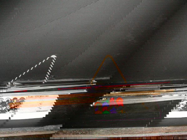 GROUP BILLIARD LOT W/ 8 CUE STICKS BRIDGE ETC 1728: Great group billiard lot with 8 cue sticks (2 titanium), a bridge, rack, & professional set of balls. Dimensions: Varied Age: Varied Material: Varied