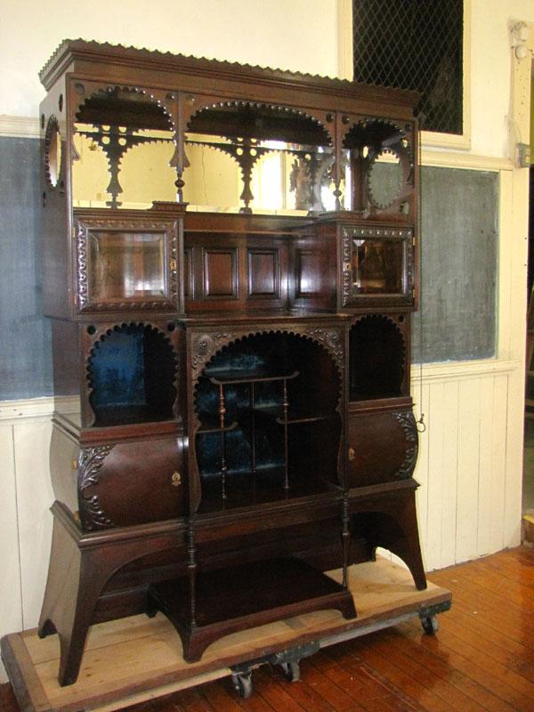 HOODED ORIENTAL WOOD ETEGERE W/ BVLD GLASS 1640: Uniquely designed hooded carved Oriental wood etegere with beveled glass curios & mirror. Dimensions: 74"H x 51"W x 18"D Age: Material: Hard wood