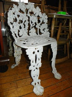 WHITE PTD CAST IRON CHAIR GRAPE MOTIF 4346A: One of two white painted antique cast iron chair in grape with vine motif. One of two being sold separately. 27"H x 18"W x 20"D. Age: C.1930. Material: Cast Iron