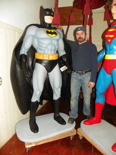 OVERSIZED BATMAN STATUE 4331: Contemporary fiberglass oversized statue of Batman (Tom not included) 76.5"H x 47"W x 24"D. Age: Contemporary. Material: fiberglass