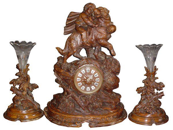 3PC BLACK FOREST ST. BERNARD & BOY CLOCK SET 15774: Remarkable three piece Black Forest clock set of highly sought after Saint Bernard rescuing boy with side foliate motif epergnes, all exceptionally carved. Dimensions: Clock-22 1/2"H x 17"W x 9 1/2"D