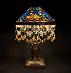 MOSIAC STAINED GLASS EGYPTIAN TABLE LAMP 2464: Wonderful mosaic stained glass table lamp with Egyptian scene shade and bronze base. A client of ours pointed out that the base has a Tiffany Studios New York signature and also numbered 10089 (see ph