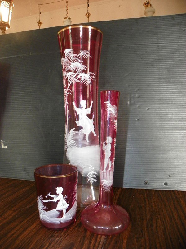 3 MARY GREGORY PCS 2295: Three Mary Gregory pieces large vase, bus vase and cup. Dimensions: 13.5"H x 8"H x 3.5"H. Age: C 1900 Materials: Glass