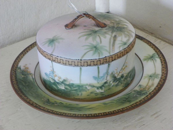 SGD NIPPON PANCAKE DISH & COVER IN PALM TREE (1527: Signed Nippon pancake dish and cover in palm tree motif. Dimensions: 4"H x 8"Dia Age: C. Material: China