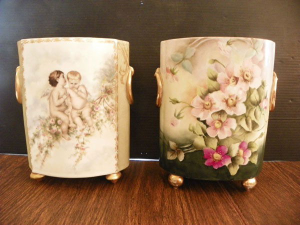 2 SM LIMOGES PORCELAIN WASTE PAPER BASKETS 2346: Two small Limoges porcelain waste paper baskets one with cupids and one floral. Dimensions: Both are approximately 9"H x 7"L x 4"W. Age: C 1900. Materials: Porcelain WE HAVE THREE LOTS OF THESE COLLE