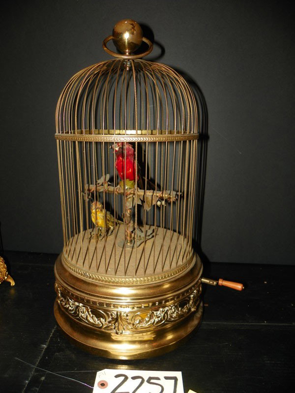 22" HIGH MECHANICAL SINGING 2 BIRDS CAGE 2257: Medium sized round mechanical singing bird cage with two birds. Dimensions: 22"H x 11"Diameter. Age: C 1880. Materials: Bird and Brass. WE HAVE 3 GREAT BIRD CAGES, TWO OF WHICH ARE VERY LARGE. PLEASE 