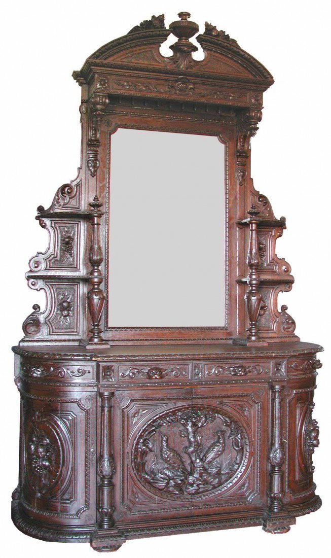 OAK HUNTBOARD W/BIRD MOTIF CENTER DOOR 991532: Oversized carved oak hunt board with bird motif center door, curved side panels in nut and berry motif, figural pulls and broken arch pediment. Dimensions: 124" H x 74" W x 26" D Age: C. 1880 Material