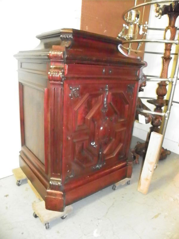 RARE LG CARVED MAHOGANY MUSIC BOX DISC HOLDER 2133: Hard to find carved mahogany oversized music box disc holder with raised top to hold your favorite statue and cartouche shield center door. Dimensions: 49"H x 37.5"W x 29.5"D Age: C 1880 Materials; Ma