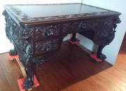 Antique carved mahogany RJ Horner winged Griffin partners desk w/ northwind face side panels