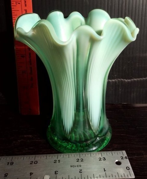 Vintage green to opalescent White pinched edge feather design art glass vase: Vintage green to opalescent White pinched edge feather design art glass vase.