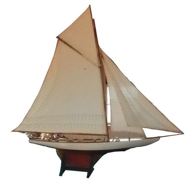 OVERSIZE MODEL SAILBOAT WITH ORIGINAL SAILS 1590: Oversized model sailboat with carved wood and original sails. Dimensions: 66”H x 69”L x 9”W Age: Contemporary Material: Wood Cloth and Rope