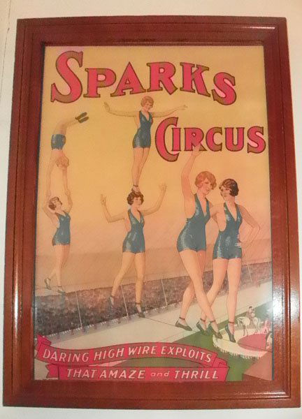 PRINT OF SPARKS CIRCUS TIGHT ROPE WALKER 30324: Framed print of Sparks Circus tight rope walking girls in oak frame. Dimensions: 44.25"H x 31.5"W Age: C. 1920 Material: Oak and Print
