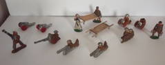 12 vintage lead toy soldiers -Manoil #69, 81, 728, 774 medic with stretcher & Barclay ammunition run