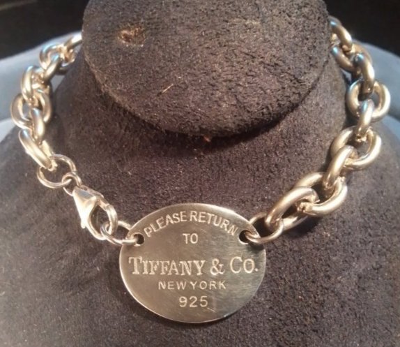 Vintage Chain link Sterling Tiffany & Co. Tag bracelet, 8": Vintage Chain link Sterling Tiffany & Co. Tag bracelet, 8". Please note: I only believe the Tag portion of this bracelet as well as the clasp is sterling. I could only find a mark on the clasp reading
