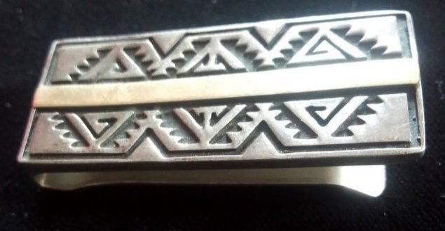 Vintage Navajo design sterling & gold money clip marked 14 K Calvin .77 troy ounces: Vintage Navajo design money clip marked 14 K Calvin, Sterling & yellow gold stripe .77 troy ounces. I can only guess at its age in which I believe to be the last half of the 20th century. I almost tho