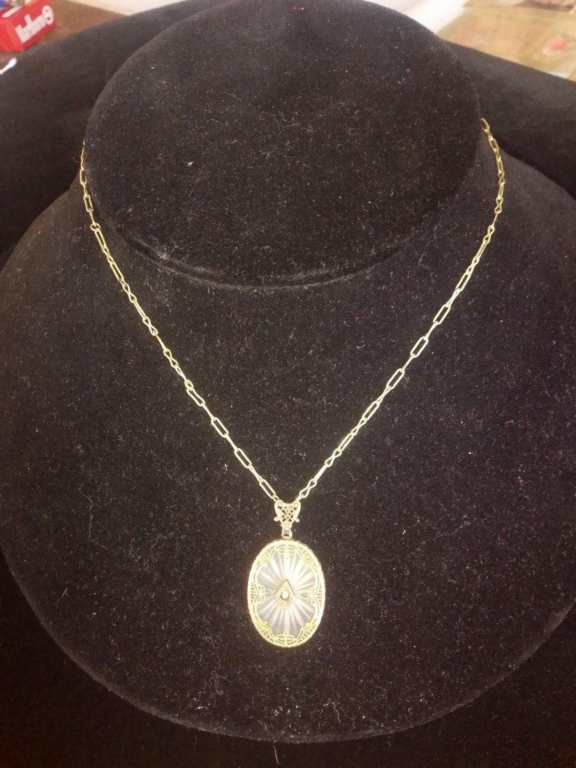 Vintage art deco champhor glass filigree pendant on 12 K GF necklace 15.5" chain: Vintage art deco champhor glass filigree pendant on 12 K GF necklace 15.5" chain. This is a really neat piece. I am uncertain if it's mid-century modern or 1920s art deco and I was only able to figure