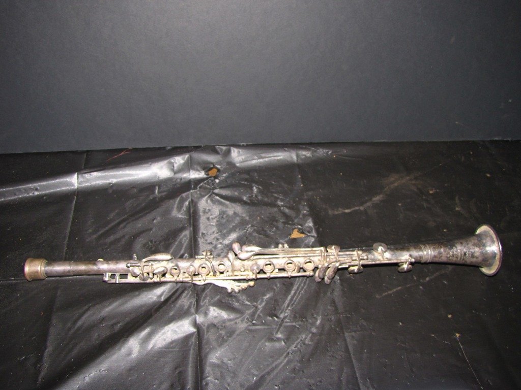 SILVERPLATED 3 STAR CUNDY BETTONEY CLARINET 116T: Silverplated three star Cundy Bettoney signed clarinet. 23"L x 2 5/8"dIa