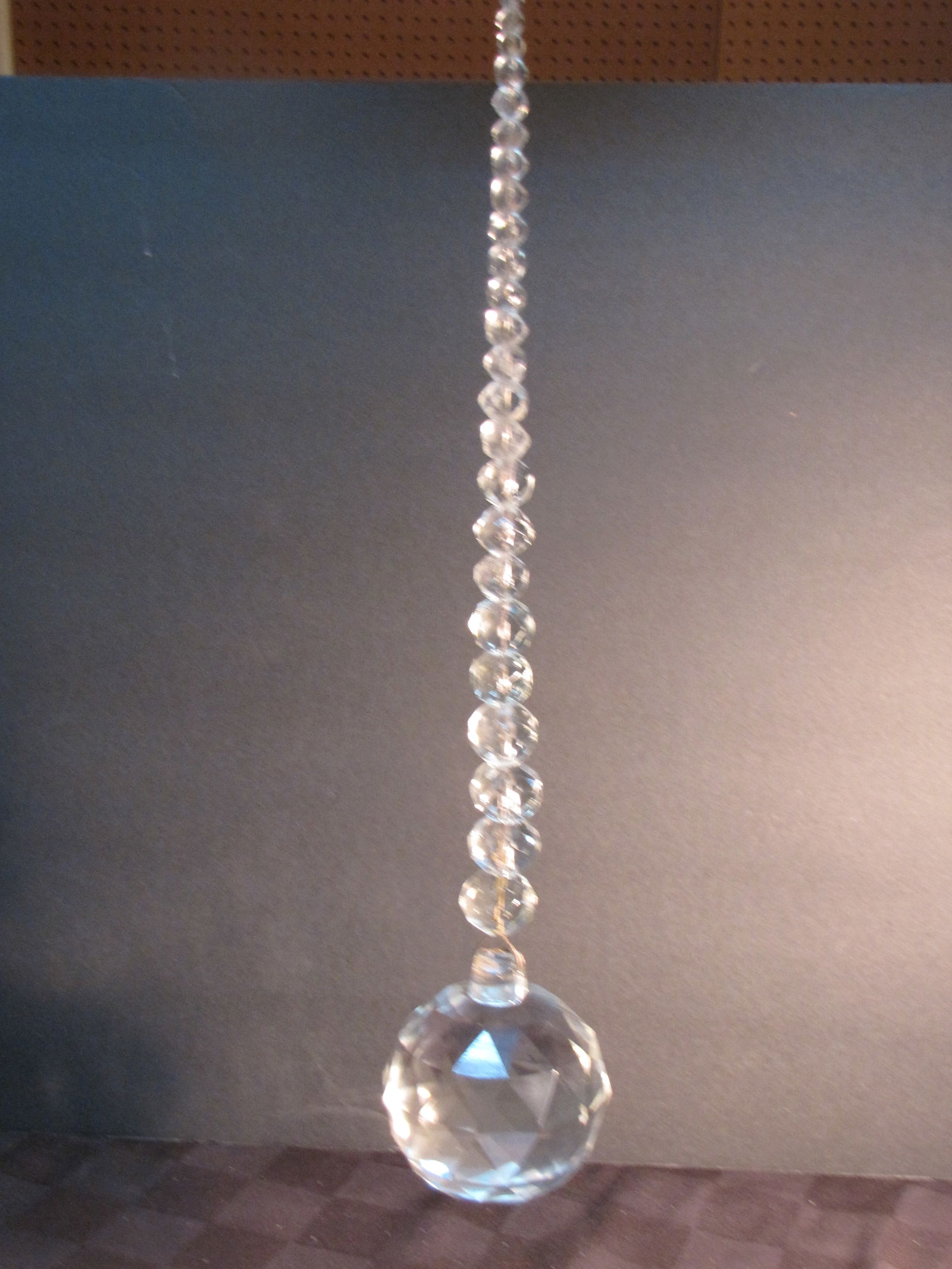 Awesome Antique 3" Dia. Crystal Ball w/ Graduated Crystal ball hanger Baccarat Quality: Awesome Antique 3" Dia. Crystal Ball w/ Graduated Crystal ball hanger Baccarat Quality. This is an old finial from a chandelier and would be great as a sun catcher. Circa 1890 I am hoping to get anoth