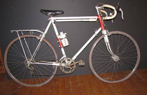 ANTIQUE 10 SPEED BICYCLE BY LIBERTAS WITH PUMP 1532: Antique Libertas bicycle with 25" rims and bike pump attached. Measurements are 39"H x 69"Long